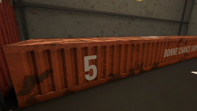 Un conteneur orange à demi-hauteur, numéroté 5, aux couleurs de Bonne Chance Shipping.
